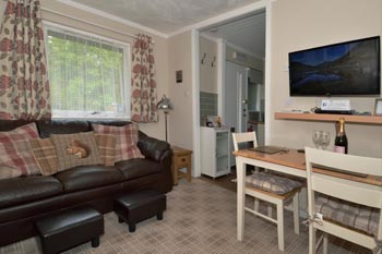 Living room with a wide selection of books, games, DVD's and magazines.